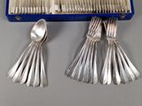 a box of silverware with spoons and spoons in it
