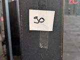 a sticker on the side of a black suitcase