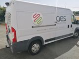 a white van that is parked in a parking lot