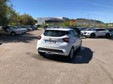 a white car that is parked in a parking lot