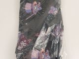 a black shirt with a cupcake on it wrapped in plastic