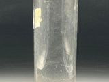a glass vase with a yellow flower inside of it