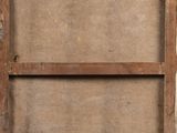 an old wooden frame with a picture hanging on the side of it
