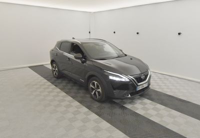 the car is parked in the garage on the checkered floor