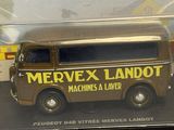 a toy van that is sitting in a clear box