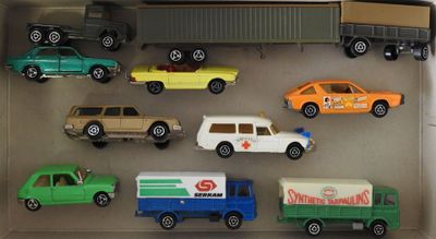 many toy cars and trucks in a display case