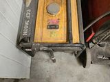 a small machine that is sitting in a garage