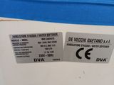 the back of a blue and white refrigerator with two labels on it