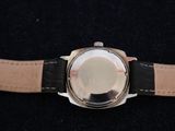 an image of a close up of a watch on a black surface