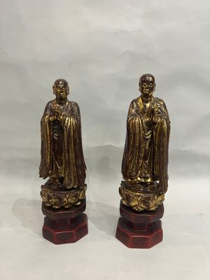 pair of antique brass figurines of a monk and a monk