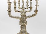 an image of a silver colored menorah with candles on it
