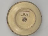 a white plate with a number on it on a table