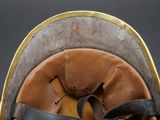a close up of a helmet with a leather cover