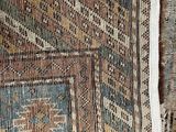 a close up of a rug with a pattern on it