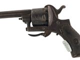 an old gun with a wooden handle on a white background