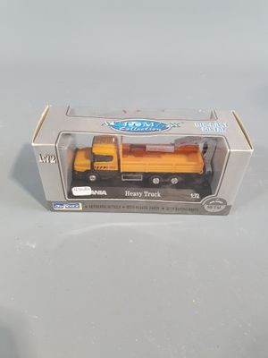 a toy truck that is in a box on a table