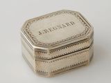 an antique silver box with the word bergnap engraved on it