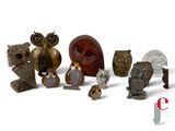 many different types of figurines displayed on a white surface