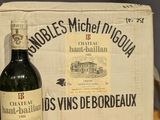 a bottle of wine sitting on a table next to a box of wine