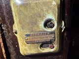 a close up of a metal box with a thermometer on it