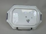 a white tray with a blue and white design on it
