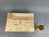 wooden box with a bottle of wine and a bottle of wine in it