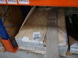 boxes of wood are stacked on a shelf in a store