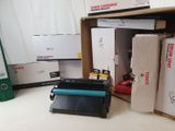 a pile of boxes and a printer sitting on a table