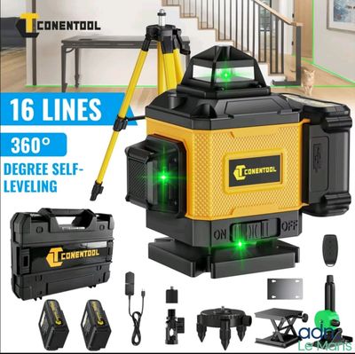 un gros plan d'une boîte contenant un niveau laser vert et d'autres outils