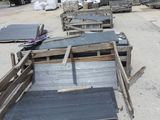 many pieces of wood that are sitting on the ground