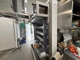 an image of a commercial kitchen with a lot of shelves