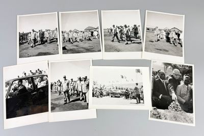 several old black and white photos of people and vehicles in a field