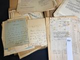 a lot of old papers that are on a table