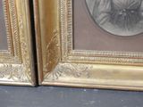 two framed pictures of a woman in a dress and a man in a tuxedo