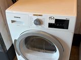 a washer and dryer sitting next to each other in a room