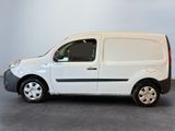 the white van is parked on the concrete floor in the room