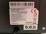 a label on the back of a laptop that is connected to a cable