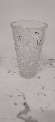 a glass vase that is sitting on a table