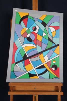 peinture abstraite sur chevalet, sur fond noir, avec un chevalet en bois