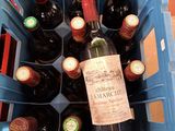 many bottles of wine in a blue plastic crate