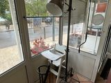 a small table and chair in the corner of a room