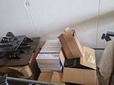 a pile of boxes and other items in a room