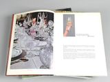 an open book with a picture of a table set for dinner