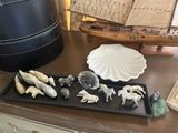 a tray that has a lot of figurines on it