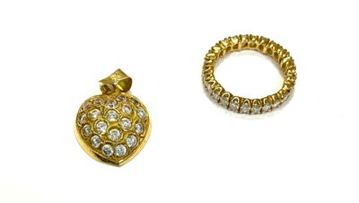 two pieces of gold and diamond jewelry on a white surface
