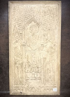 an image of a stone relief of a man and a woman