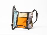 an image of a multicolored purse sitting on top of a white surface