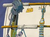 a picture of a painting of a bird hanging on a rope