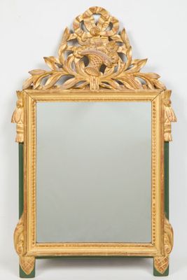 an image of a mirror with a gold frame and green trim