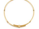 a gold bang bracelet with a beaded clasp on a white background